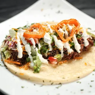 a taco on a white plate