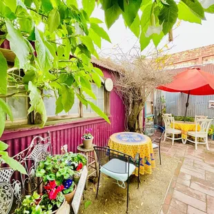 a patio with a table and chairs