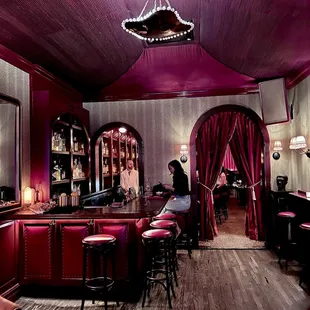 a woman sitting at a bar