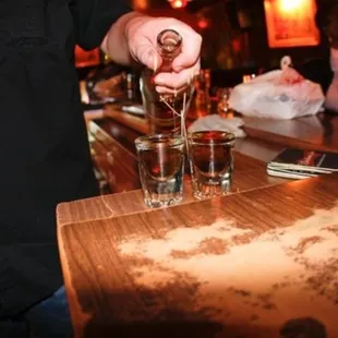 a bartender pouring a drink