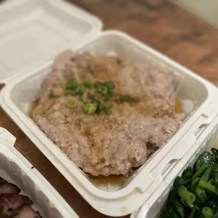 a meal in a styrofoam container