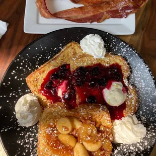 Bananas Foster and Lemon Blueberry French toast. You have to have a side of bacon!
