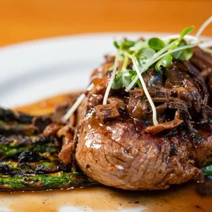 a steak and asparagus on a plate