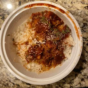 a bowl of rice and meat