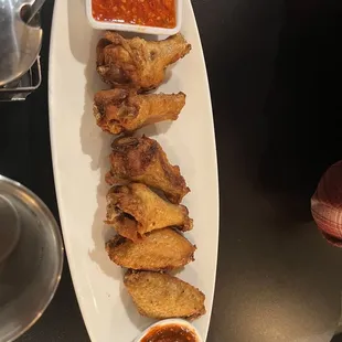 Spicy sauce with no flavor. 2$ a wing?