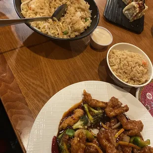 Fried rice, Orange chicken, and Eel roll (?)