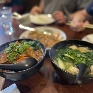 two bowls of food on a table
