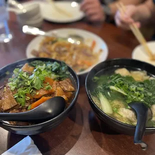 two bowls of food on a table