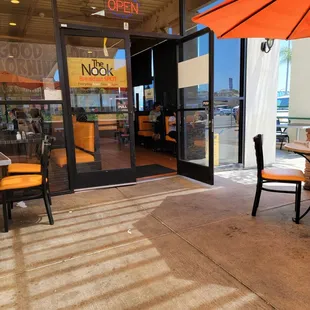 a table and chairs with an umbrella