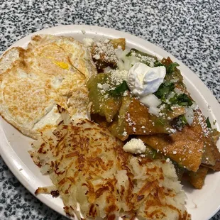Chilaquiles w over medium eggs &amp; hash browns. Just Ok