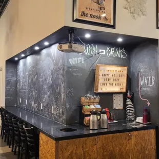 a blackboard wall with chalk writing on it