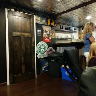 a woman sitting at a bar