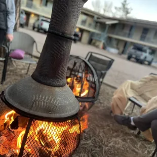 What a cute fire pit area for cozying up by the fire.