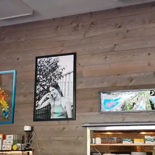 a wooden wall with pictures on it