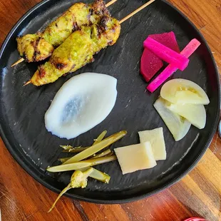a plate of food on a wooden table