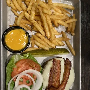 Angus burger with bacon and provolone cheese. Side of smoked cheddar sauce.