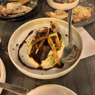 Short ribs and string beans, carrots and creamy mashed potatoes.