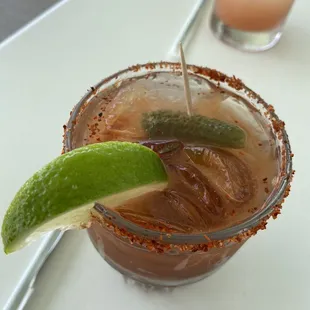 a margarita with a lime garnish