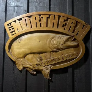 a large fish on a plaque