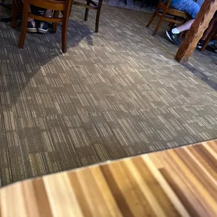It&apos;s difficult to see the crumbs and multiple napkins on this floor.  It really badly represents as you walk in.