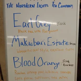 a white board with blue writing