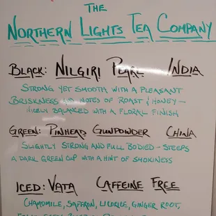 a white board with a list of drinks