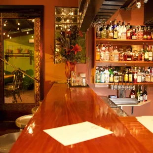 a bar with shelves of liquor