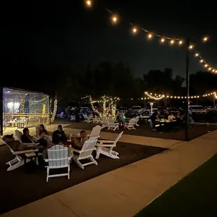 Outdoor seating area where they have fire pits!