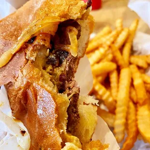 Hamburger with fried onions and mustard with fries