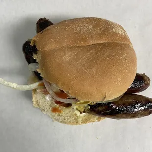 a sausage sandwich on a bun