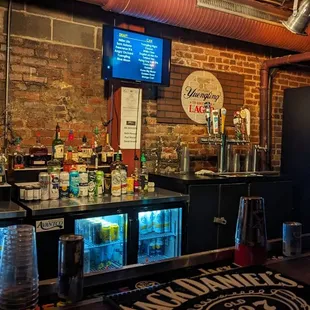 a bar with a brick wall