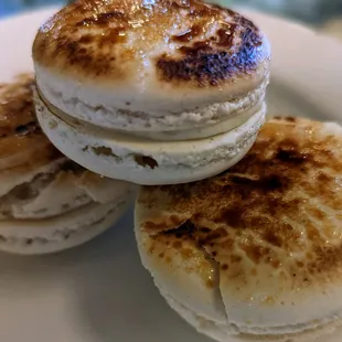 three macarons on a plate
