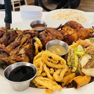 The Noypitz platter! Crispy pata, calamari, lumpia shanghai, pancit bihon, half fried chicken and 1talong. LEGITTT BIG PLATTER.