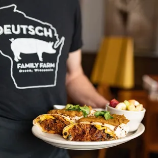 a man holding a plate of food