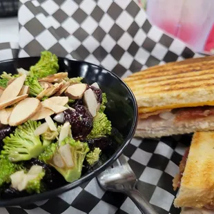 a grilled sandwich and a salad