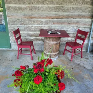 Outside seating for eating or there is usually a checkerboard game set up