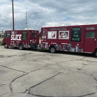 two food trucks parked in a parking lot
