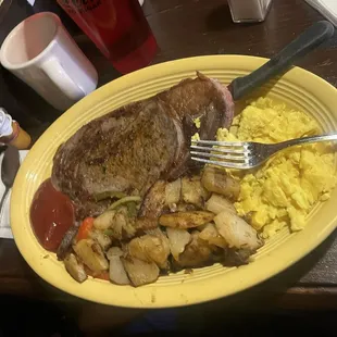 Ribeye steak and country potatoes &amp; scrambled eggs