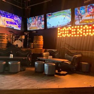 a stage with chairs and stools