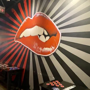 a red lip painted on the wall