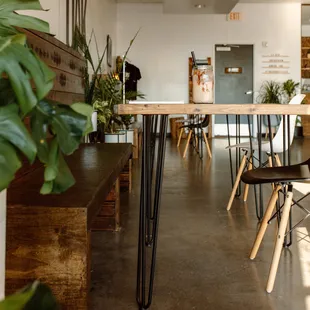 a dining area with tables and chairs
