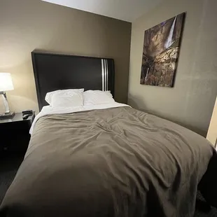 One of the beds in the room