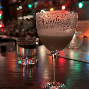 a glass of alcohol on a table