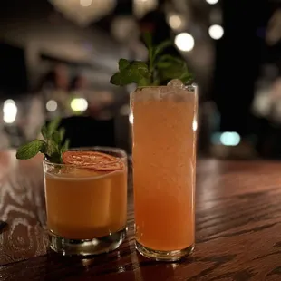 two cocktails on a bar