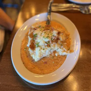 a plate of mashed potatoes and gravy
