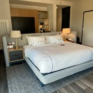 Full view of the king bed and nightstand on each side.