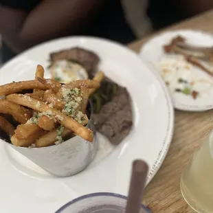 Steak and eggs with garlic truffle fries