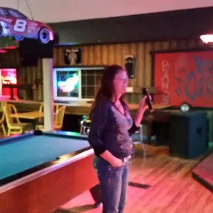 a woman playing pool