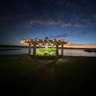 a gazebo lit up at night