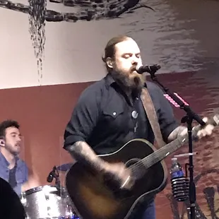 a man playing a guitar